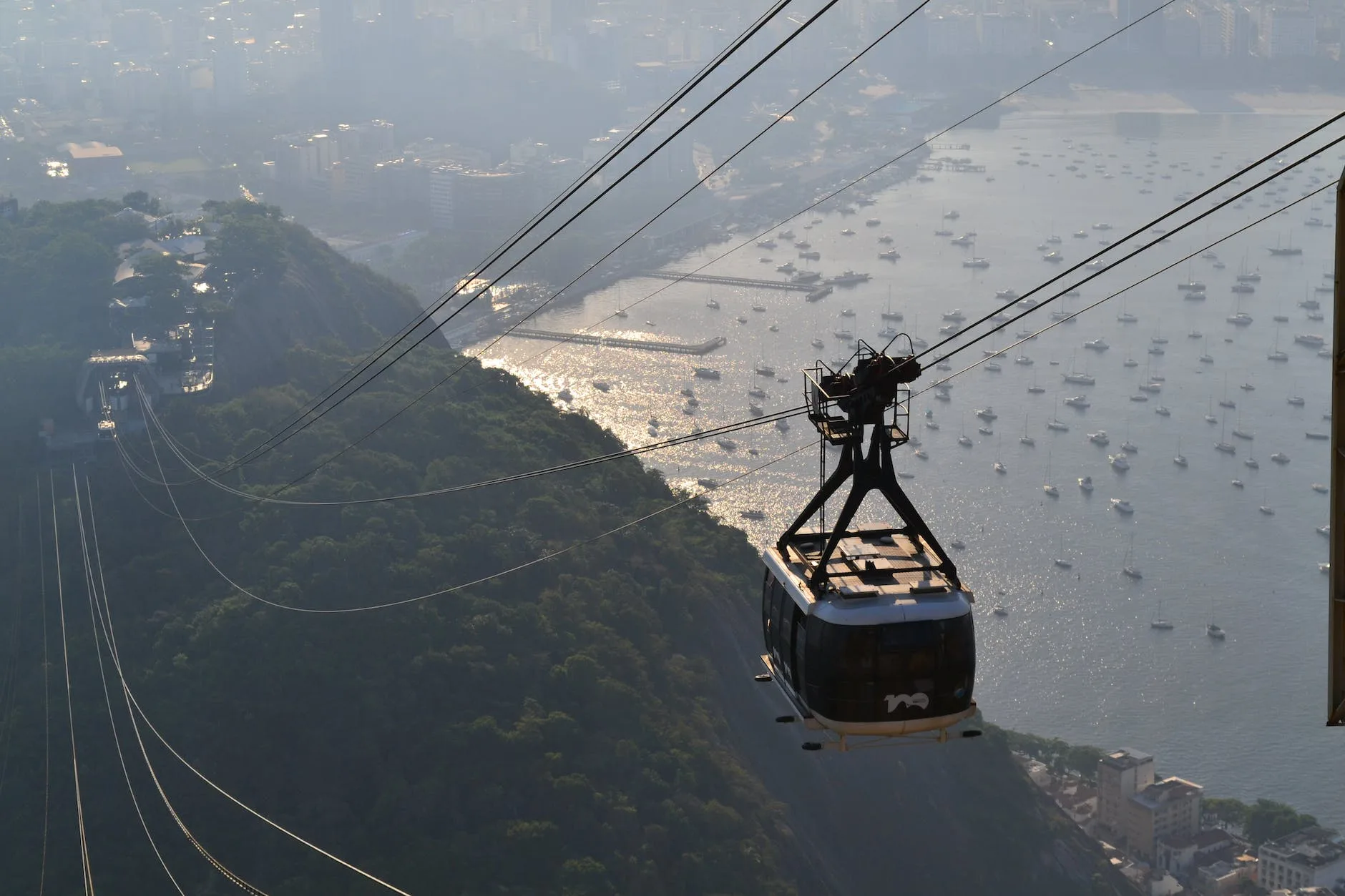 a black cable car over sugarloaf mountain in rio de janeiro brazil