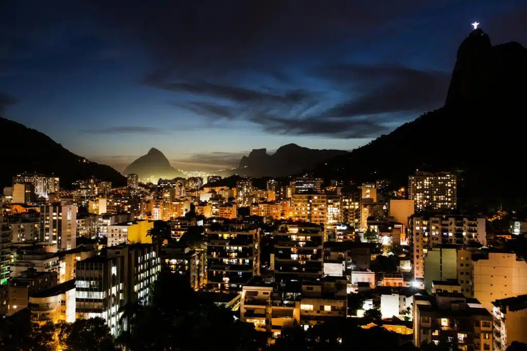 an aerial shot of the city of rio de janeiro at night