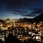 an aerial shot of the city of rio de janeiro at night