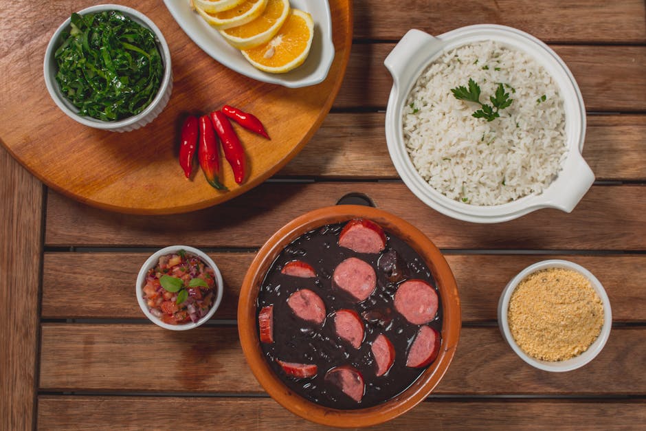 delicious Brazilian feijoada with side dishes