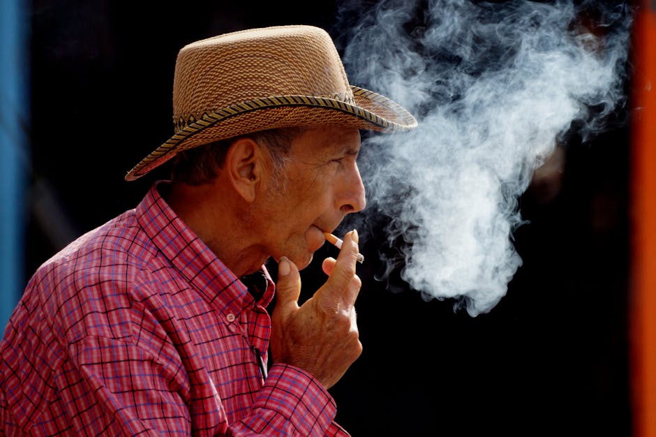 man in plaid shirt and straw hat dancing inside Brazil
