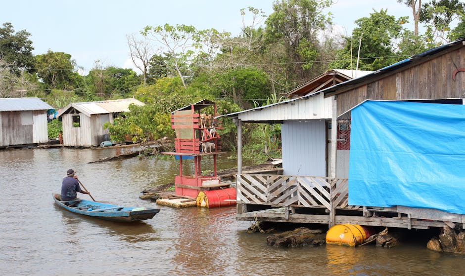 motorboat approaching riverside community brazil