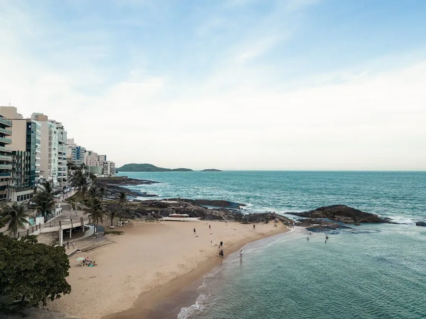 people walking on Guarapari beach in Brazil