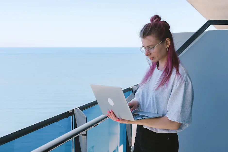 person working laptop beach balcony in Brazil