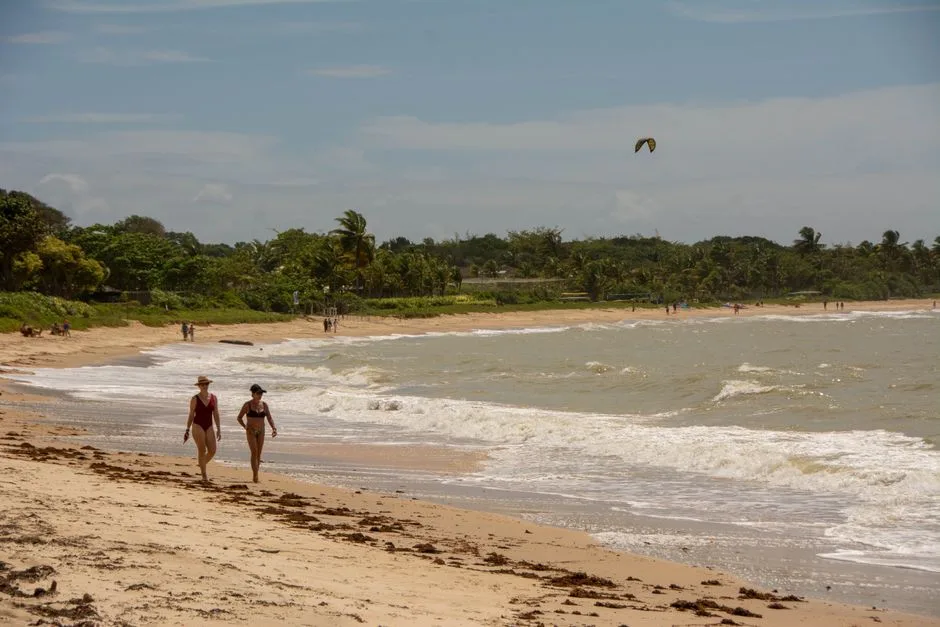 woman walking colorful bikini beach in Brazil