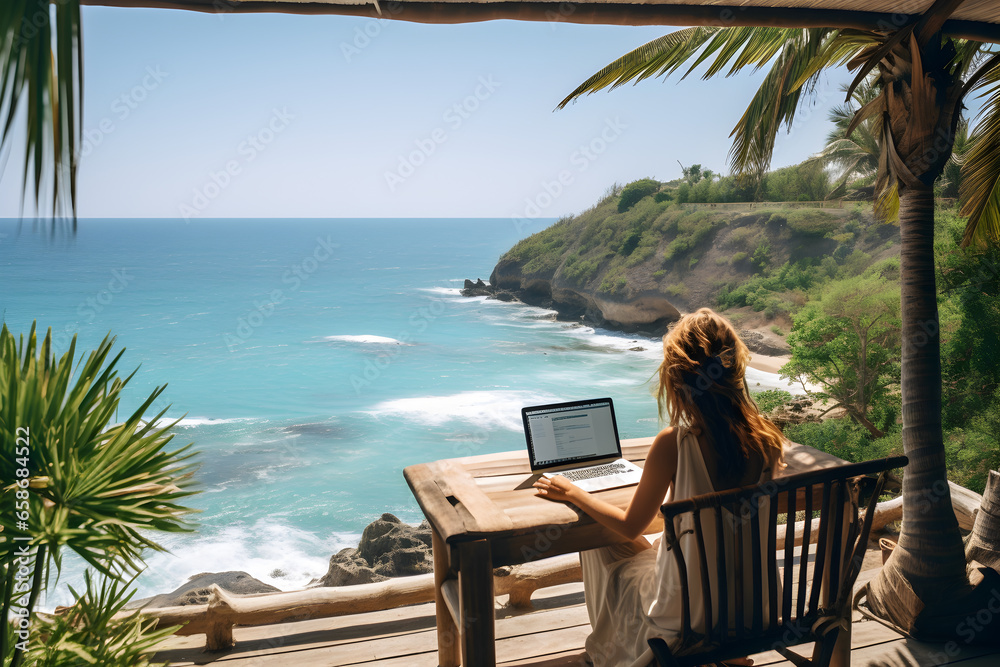 person working laptop ocean view