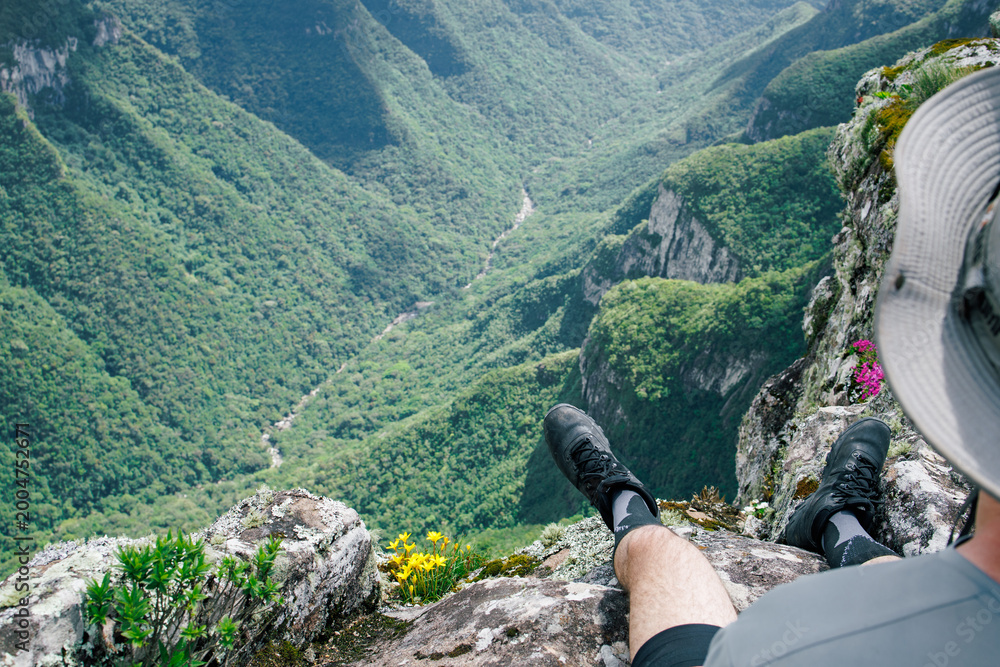 hiker overlooking deep canyon Brazil in Brazil