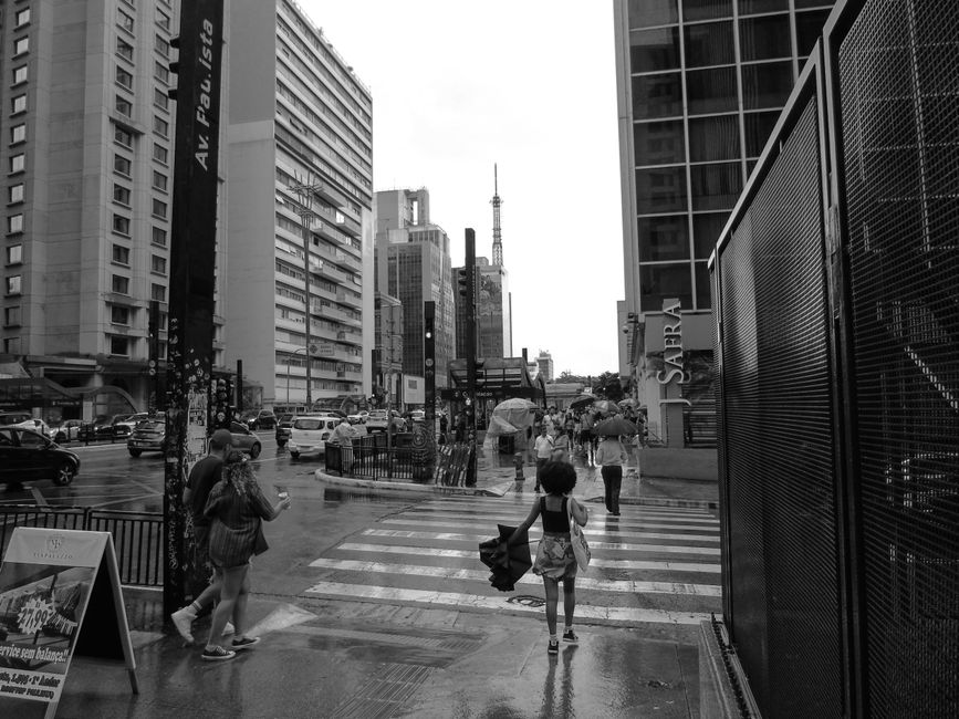 Bundled traveler Sao Paulo rain in Brazil