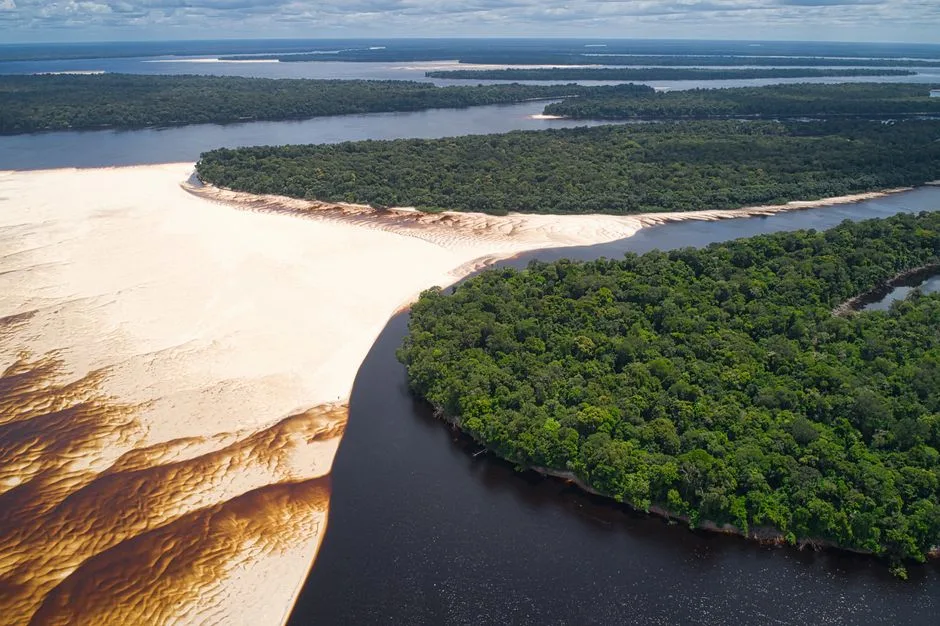 boat at exposed river sandbank in Brazil