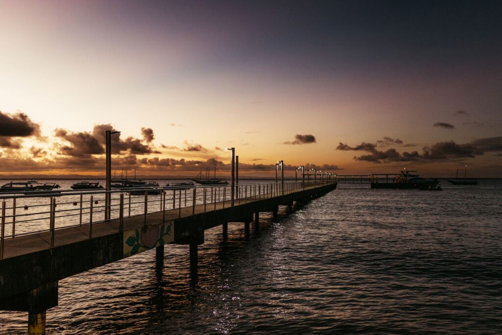 Arraial d'Ajuda wooden pier sunset in Brazil